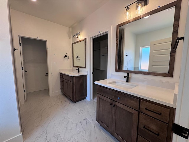 6101 Kinnick Dr, Edmond, OK 73034 - bathroom with two vanities and marble finish floors