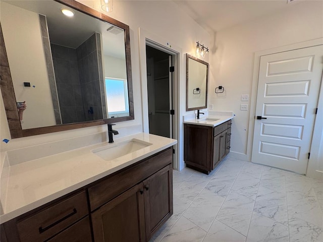 6101 Kinnick Dr, Edmond, OK 73034 - full bath with marble look tiles and two vanities