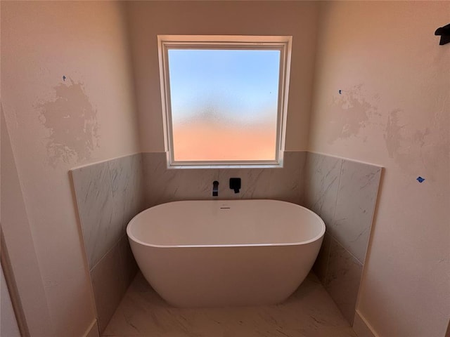 6101 Kinnick Dr, Edmond, OK 73034 - bathroom with a freestanding tub and marble finish floors