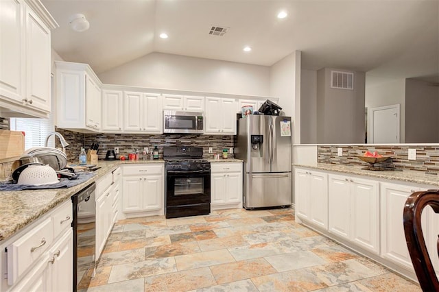 2732 SE 90th St, Moore, OK 73160 - kitchen featuring stainless steel appliances, tasteful backsplash, white cabinets, light stone finish flooring, and light stone counters