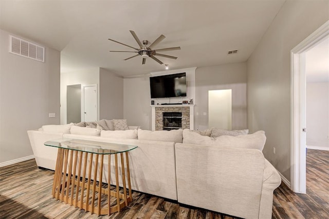 2732 SE 90th St, Moore, OK 73160 - living room featuring ceiling fan, dark wood finished floors, and a stone fireplace