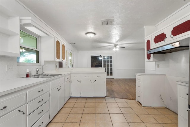 39525 W 151st St, Bristow, OK 74010 - kitchen featuring ceiling fan, light countertops, white cabinetry, a peninsula, and light tile patterned floors
