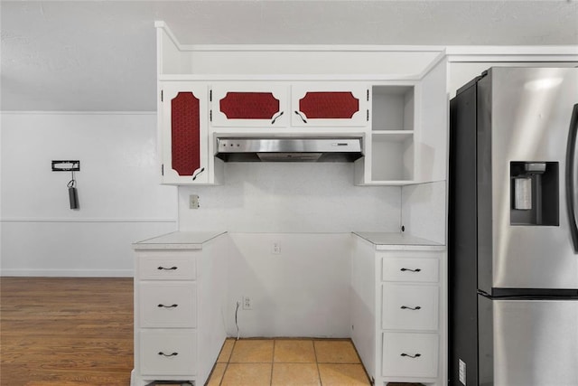 39525 W 151st St, Bristow, OK 74010 - kitchen featuring stainless steel refrigerator with ice dispenser, under cabinet range hood, light countertops, and white cabinetry