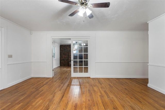 39525 W 151st St, Bristow, OK 74010 - spare room with wood finished floors, ceiling fan, and ornamental molding