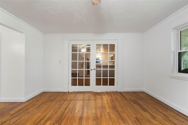 39525 W 151st St, Bristow, OK 74010 - spare room with french doors, wood finished floors, and ornamental molding