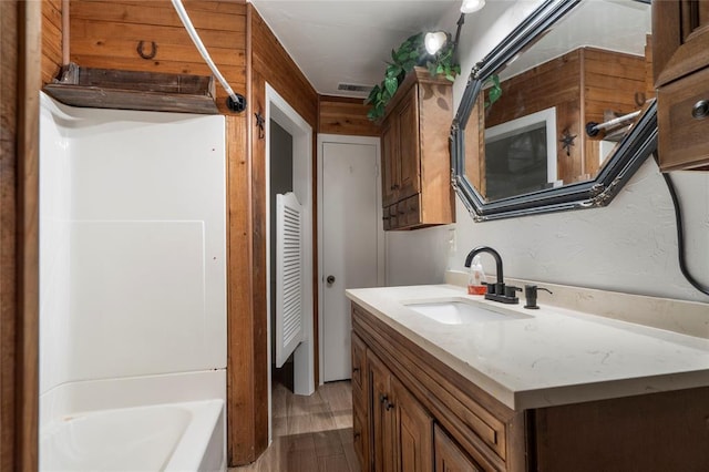 39525 W 151st St, Bristow, OK 74010 - full bath with vanity, wood finished floors, and bathing tub / shower combination