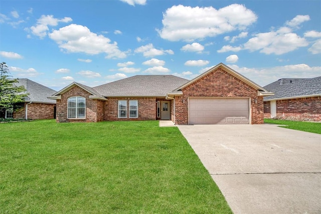 1809 Foxtail Cir, Altus, OK 73521 - ranch-style home with driveway, an attached garage, a front lawn, and brick siding