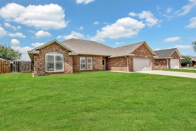 1809 Foxtail Cir, Altus, OK 73521 - single story home with an attached garage, concrete driveway, brick siding, and roof with shingles