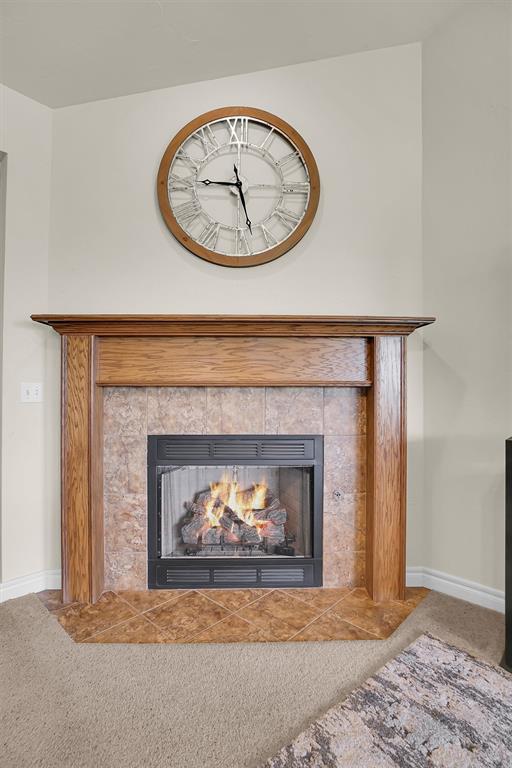1809 Foxtail Cir, Altus, OK 73521 - detailed view of carpet and a tile fireplace