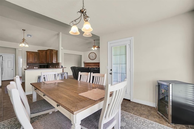 1809 Foxtail Cir, Altus, OK 73521 - dining room featuring ceiling fan and a chandelier