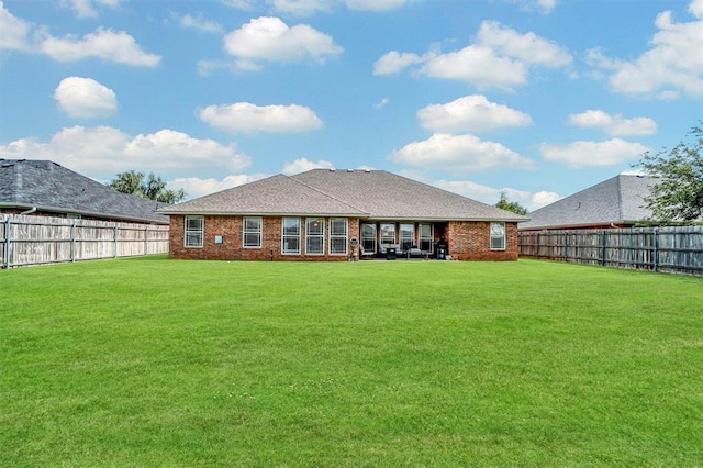 1809 Foxtail Cir, Altus, OK 73521 - back of house with a fenced backyard and brick siding