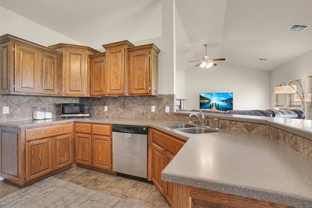 1809 Foxtail Cir, Altus, OK 73521 - kitchen with dishwasher, lofted ceiling, open floor plan, ceiling fan, and decorative backsplash