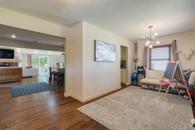 434 NW 48th St, Oklahoma City, OK 73118 - sitting room with wood finished floors, a chandelier, and a fireplace