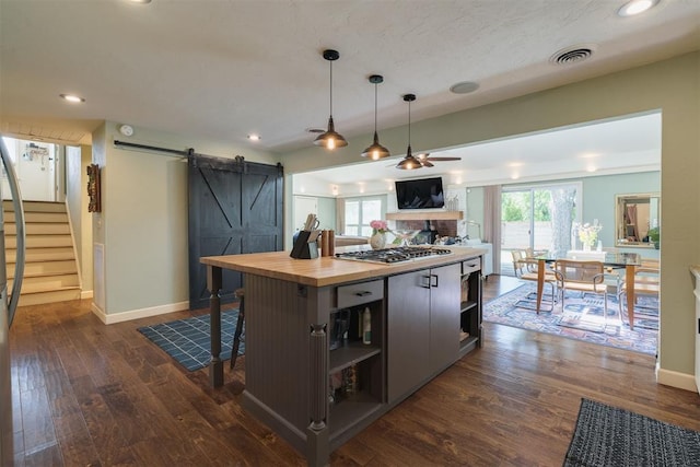 434 NW 48th St, Oklahoma City, OK 73118 - kitchen featuring open shelves, stainless steel gas cooktop, a barn door, ceiling fan, and butcher block countertops