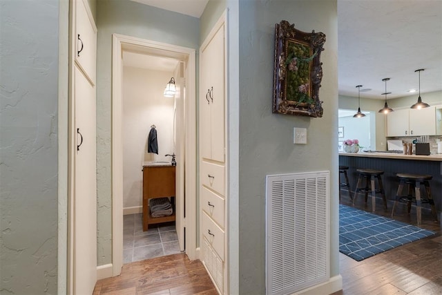 434 NW 48th St, Oklahoma City, OK 73118 - hallway with wood-type flooring and a textured wall