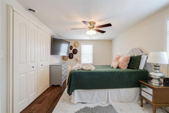 434 NW 48th St, Oklahoma City, OK 73118 - bedroom with dark wood finished floors, ceiling fan, and a closet