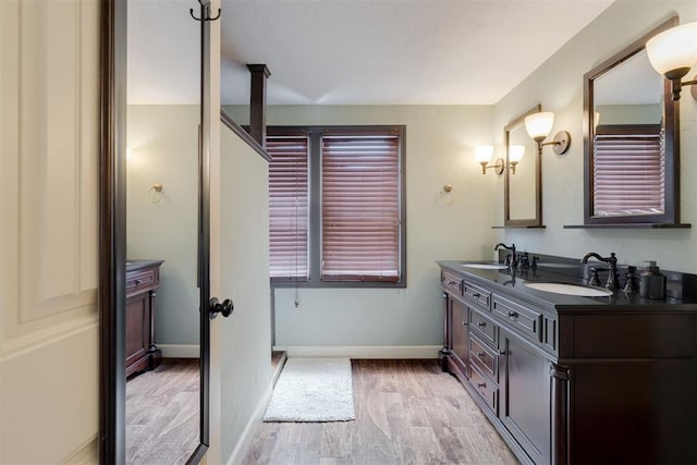 434 NW 48th St, Oklahoma City, OK 73118 - bathroom with double vanity and wood finished floors