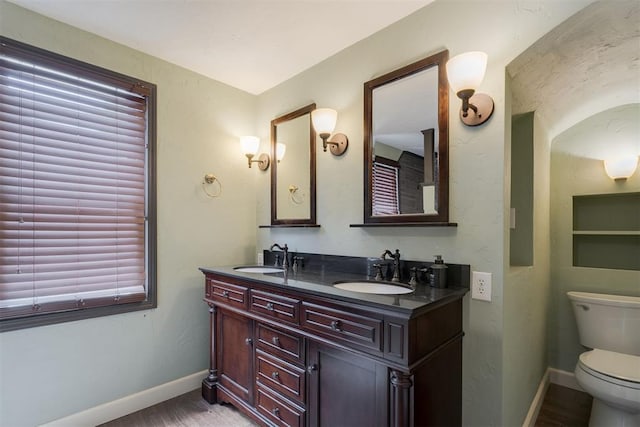 434 NW 48th St, Oklahoma City, OK 73118 - full bathroom with double vanity and wood finished floors