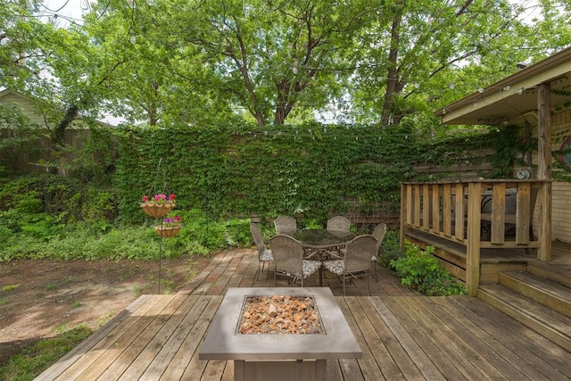 434 NW 48th St, Oklahoma City, OK 73118 - wooden terrace with an outdoor fire pit and outdoor dining area