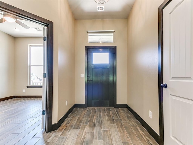 13524 SE 95th St, Oklahoma City, OK 73165 - entrance foyer featuring wood finished floors, healthy amount of natural light, and ceiling fan