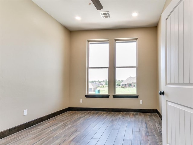 13524 SE 95th St, Oklahoma City, OK 73165 - spare room featuring wood finished floors, ceiling fan, and recessed lighting