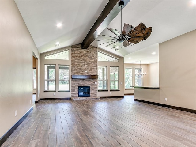 13524 SE 95th St, Oklahoma City, OK 73165 - unfurnished living room featuring ceiling fan, healthy amount of natural light, wood finished floors, and a chandelier