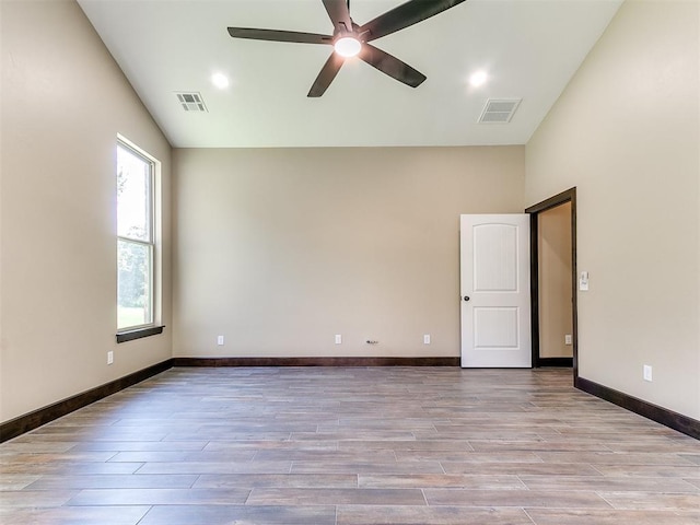 13524 SE 95th St, Oklahoma City, OK 73165 - spare room with wood finished floors, vaulted ceiling, and a ceiling fan