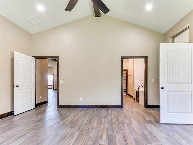 13524 SE 95th St, Oklahoma City, OK 73165 - empty room with high vaulted ceiling, a ceiling fan, light wood-type flooring, and beam ceiling