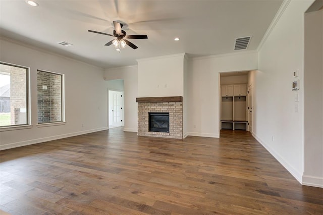 3328 Slate River Dr, Yukon, OK 73099 - unfurnished living room featuring crown molding, ceiling fan, wood finished floors, recessed lighting, and a fireplace