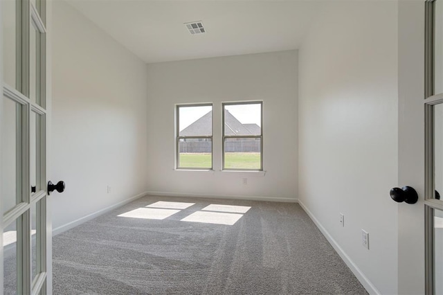 3328 Slate River Dr, Yukon, OK 73099 - unfurnished room featuring carpet floors and french doors