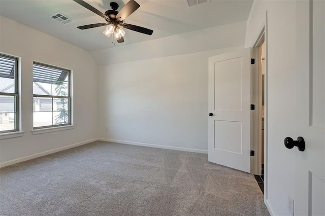 3328 Slate River Dr, Yukon, OK 73099 - spare room featuring carpet floors, a ceiling fan, and vaulted ceiling