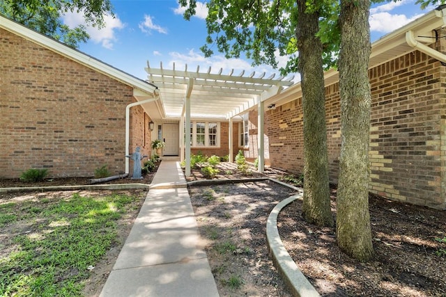 2 Terra Ln, Shawnee, OK 74804 - property entrance featuring a pergola and brick siding