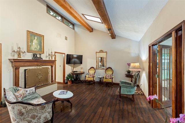 2 Terra Ln, Shawnee, OK 74804 - living area with wood finished floors, plenty of natural light, and a fireplace with raised hearth