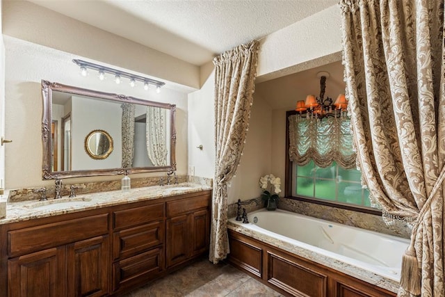 2 Terra Ln, Shawnee, OK 74804 - bathroom featuring a garden tub, double vanity, a textured ceiling, and a chandelier