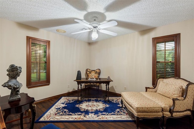 2 Terra Ln, Shawnee, OK 74804 - living area featuring a ceiling fan, wood finished floors, and a textured ceiling
