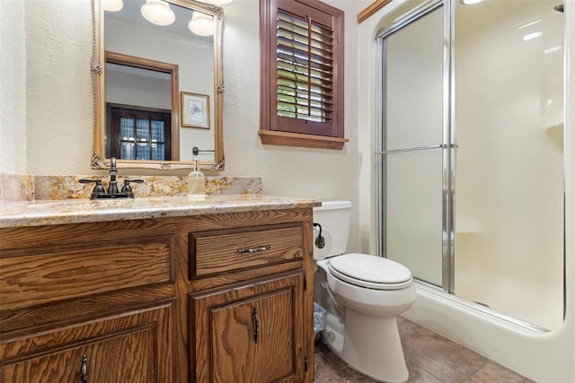 2 Terra Ln, Shawnee, OK 74804 - full bathroom featuring a textured wall, vanity, and a stall shower