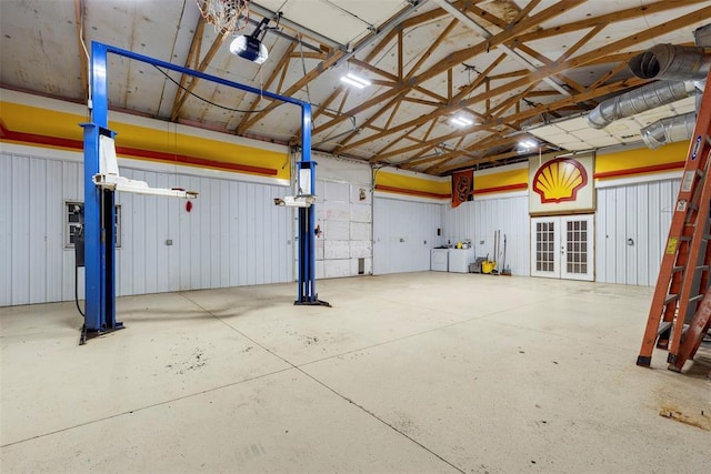 2 Terra Ln, Shawnee, OK 74804 - garage featuring french doors and a garage door opener