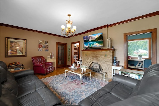 201 S Park Rd, Hobart, OK 73651 - living area with a chandelier, ornamental molding, wood finished floors, and a brick fireplace