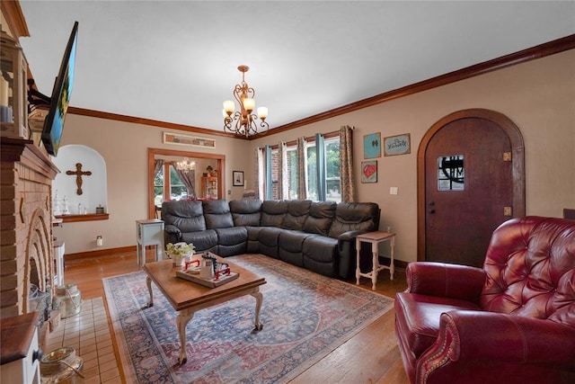 201 S Park Rd, Hobart, OK 73651 - living area featuring arched walkways, plenty of natural light, a chandelier, ornamental molding, and hardwood / wood-style flooring