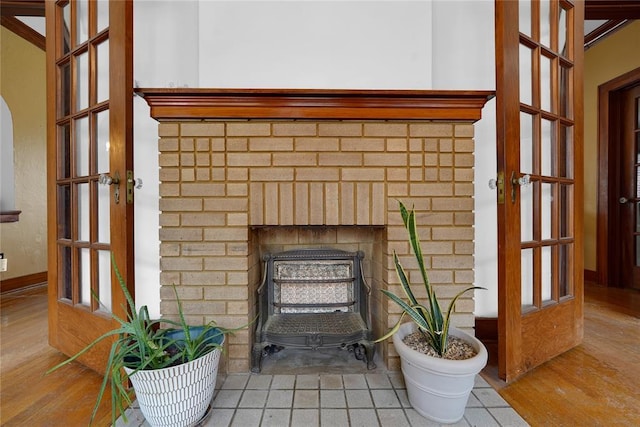 201 S Park Rd, Hobart, OK 73651 - detailed view of wood finished floors and a brick fireplace