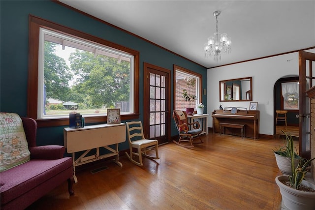 201 S Park Rd, Hobart, OK 73651 - office featuring wood-type flooring, plenty of natural light, a chandelier, arched walkways, and crown molding