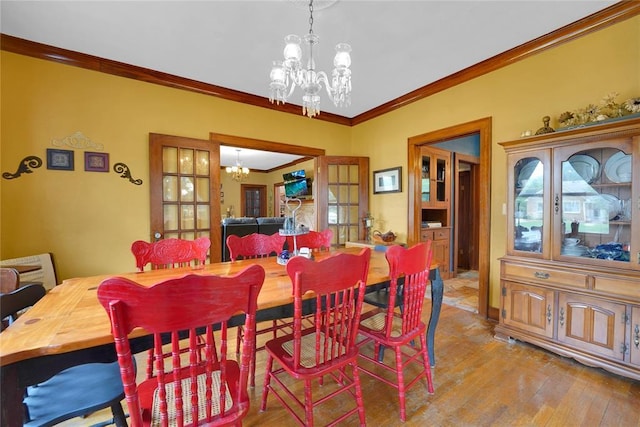 201 S Park Rd, Hobart, OK 73651 - dining room with a chandelier, hardwood / wood-style flooring, and ornamental molding