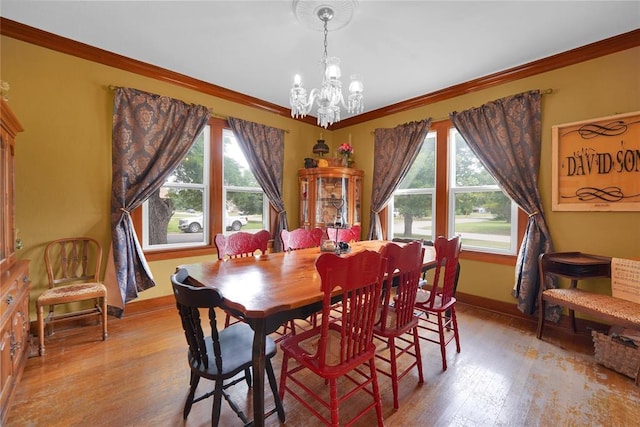 201 S Park Rd, Hobart, OK 73651 - dining room featuring plenty of natural light, ornamental molding, a chandelier, and light wood finished floors