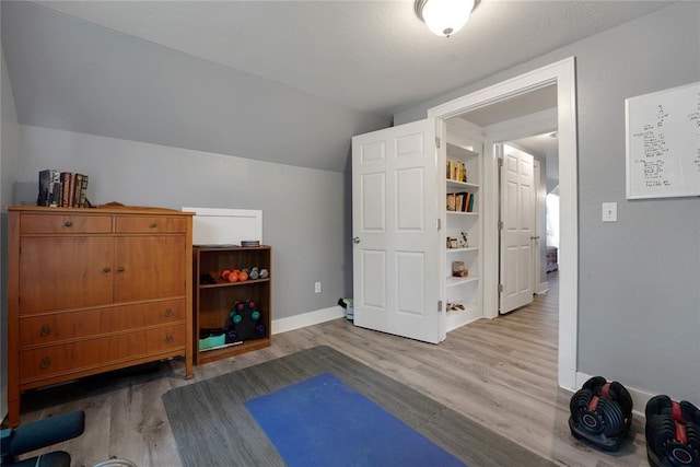 201 S Park Rd, Hobart, OK 73651 - exercise room featuring wood finished floors and lofted ceiling