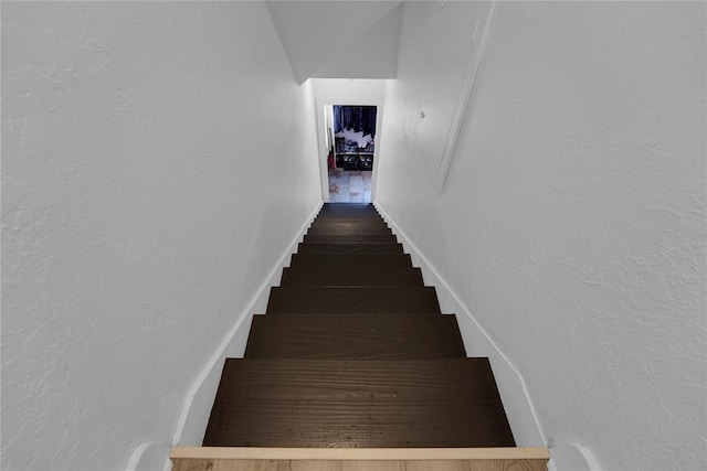 201 S Park Rd, Hobart, OK 73651 - staircase with wood finished floors and a textured wall