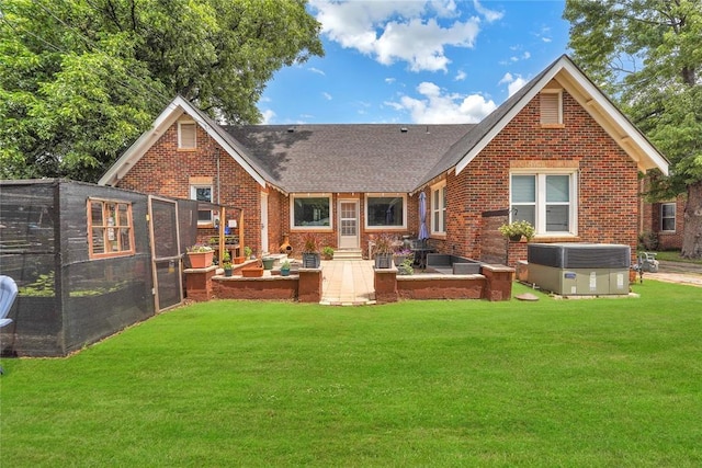 201 S Park Rd, Hobart, OK 73651 - rear view of property featuring brick siding, a lawn, a patio area, and roof with shingles
