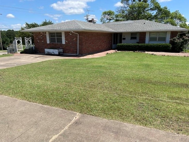 2 Sequoyah Blvd, Shawnee, OK 74801 - single story home with brick siding, a front lawn, a chimney, and roof with shingles