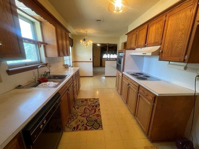 2 Sequoyah Blvd, Shawnee, OK 74801 - kitchen featuring electric stovetop, black dishwasher, under cabinet range hood, brown cabinetry, and light countertops