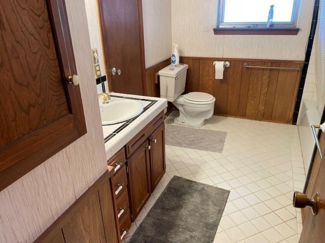 2 Sequoyah Blvd, Shawnee, OK 74801 - full bathroom featuring vanity, wainscoting, tile patterned floors, and shower / tub combo with curtain