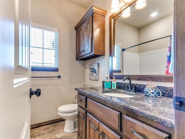 13512 SE 95th St, Oklahoma City, OK 73165 - full bath with wood finished floors, vanity, healthy amount of natural light, and a shower with shower curtain